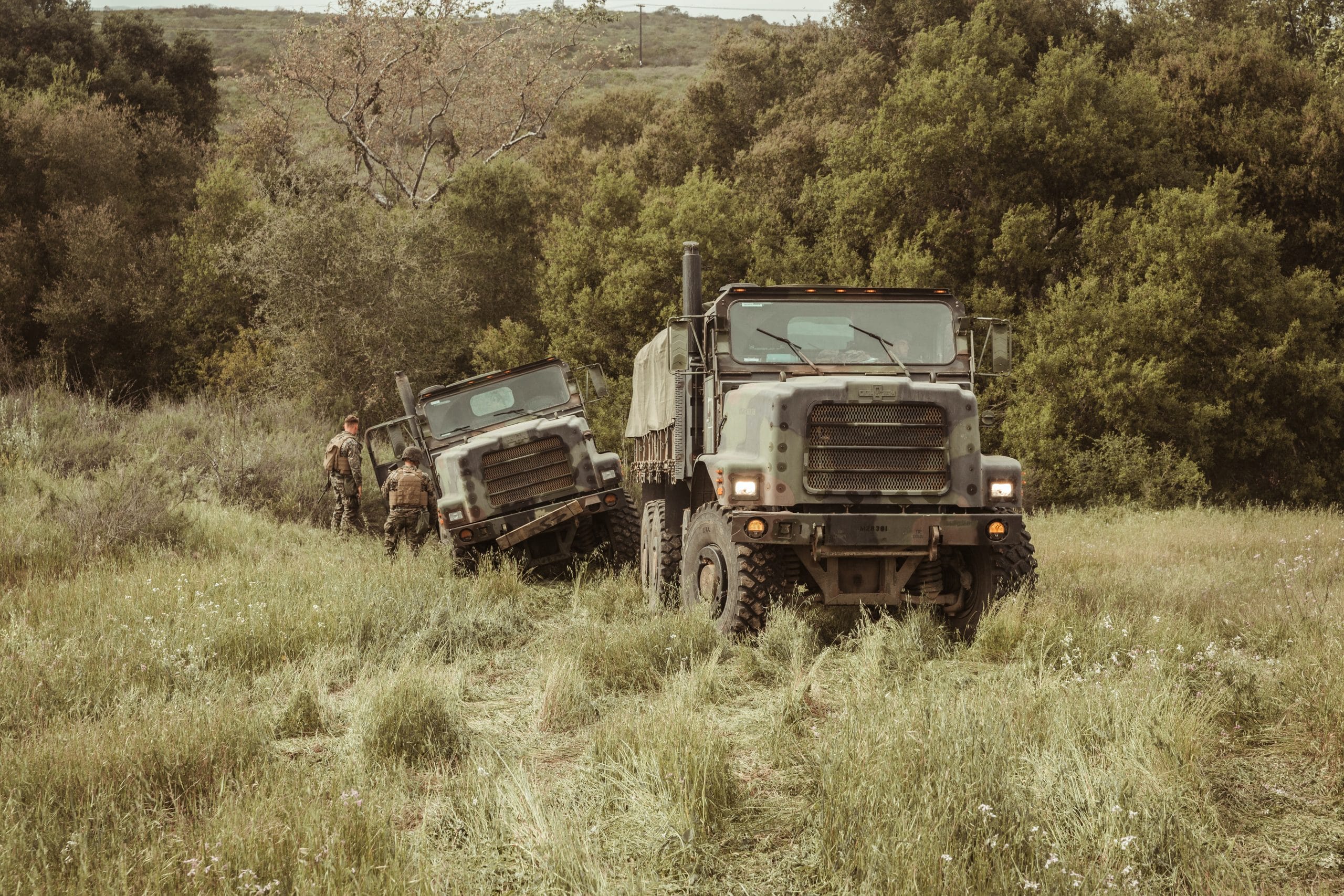 Two armored military vehicles off-road