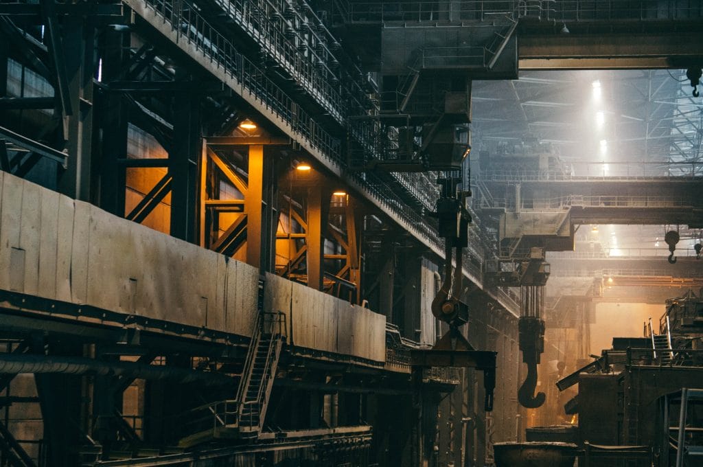 Large industrial facility interior with heavy machinery